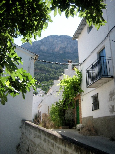 The streets of the town are narrow and steep, but people still drive cars through them. 