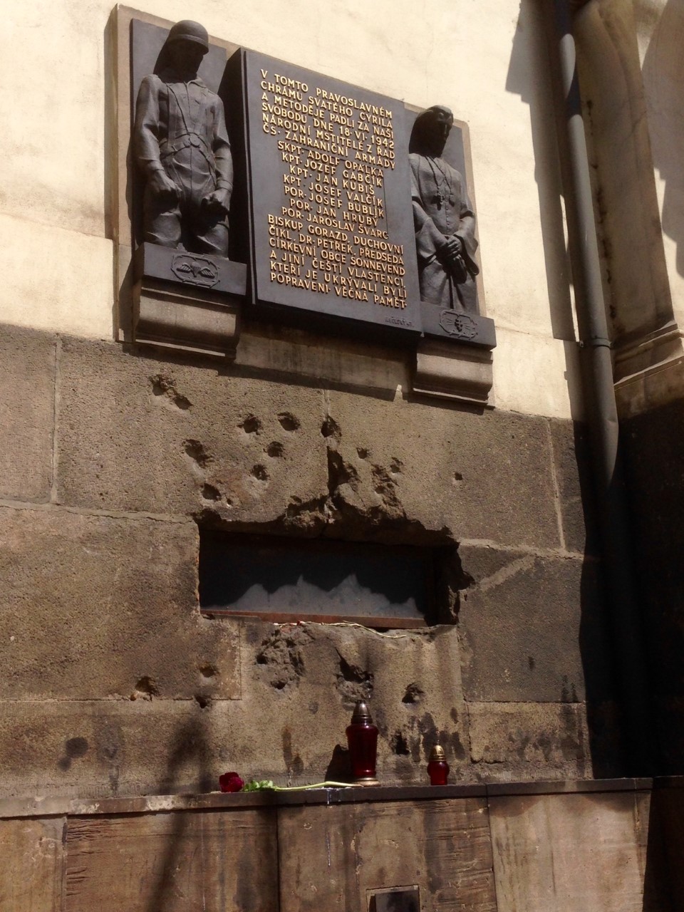 The wall of Sts. Cyril and Methodius church where the final shoot-out happened. Bullet holes frame the vent in the wall in which the fire department flooded the crypt. The plaque commemorates the battle and sacrifice. Ultimately, the priest, the bishop and the leaders of the church and their families were executed by the Nazis for harboring the Czech paratroopers. 